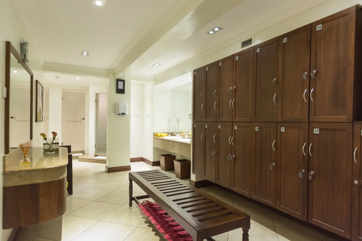Changing area with timber lockers — Heron Portico Hotel