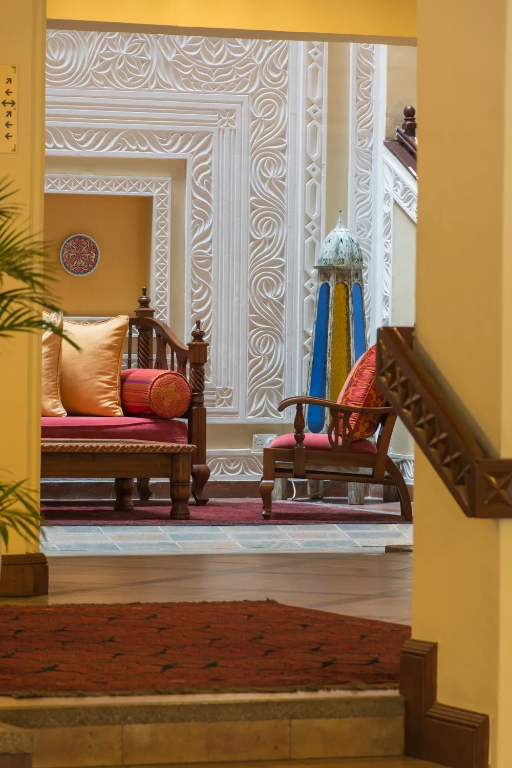 Doorway framed by carved plaster walls — Heron Portico Hotel