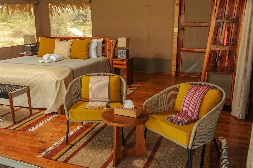 Guest bedroom with a pair of chairs — Mara Siana Tented Camp