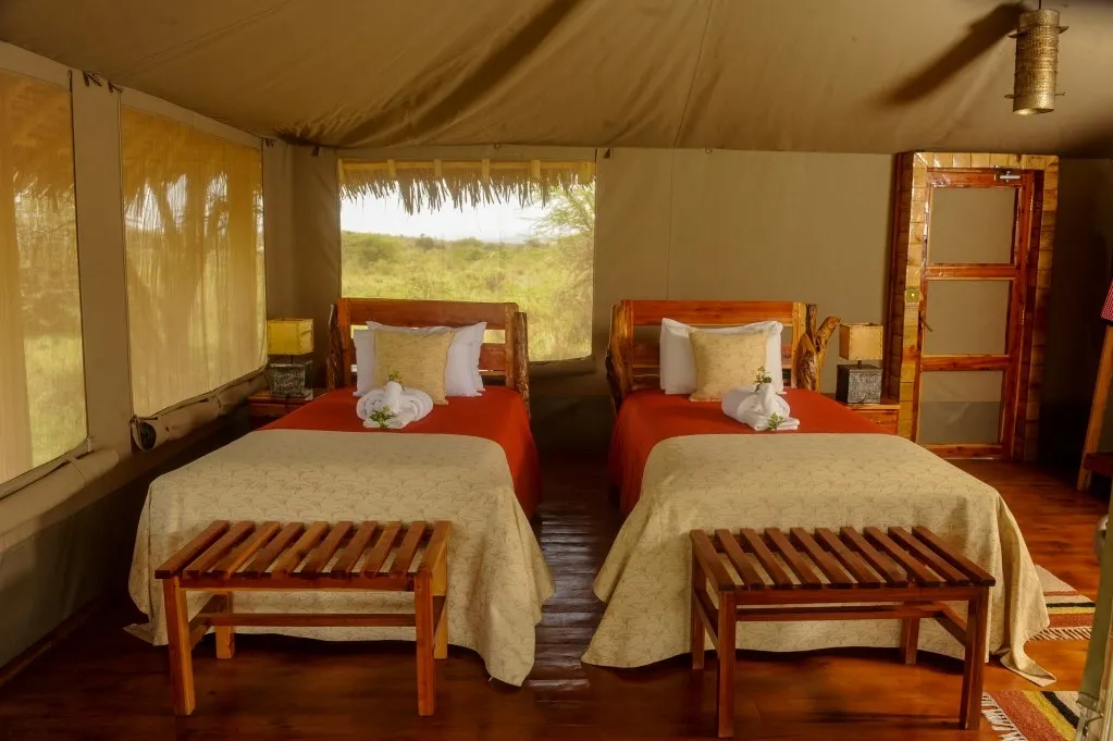 Twin beds and bedside furnishings — Mara Siana Tented Camp