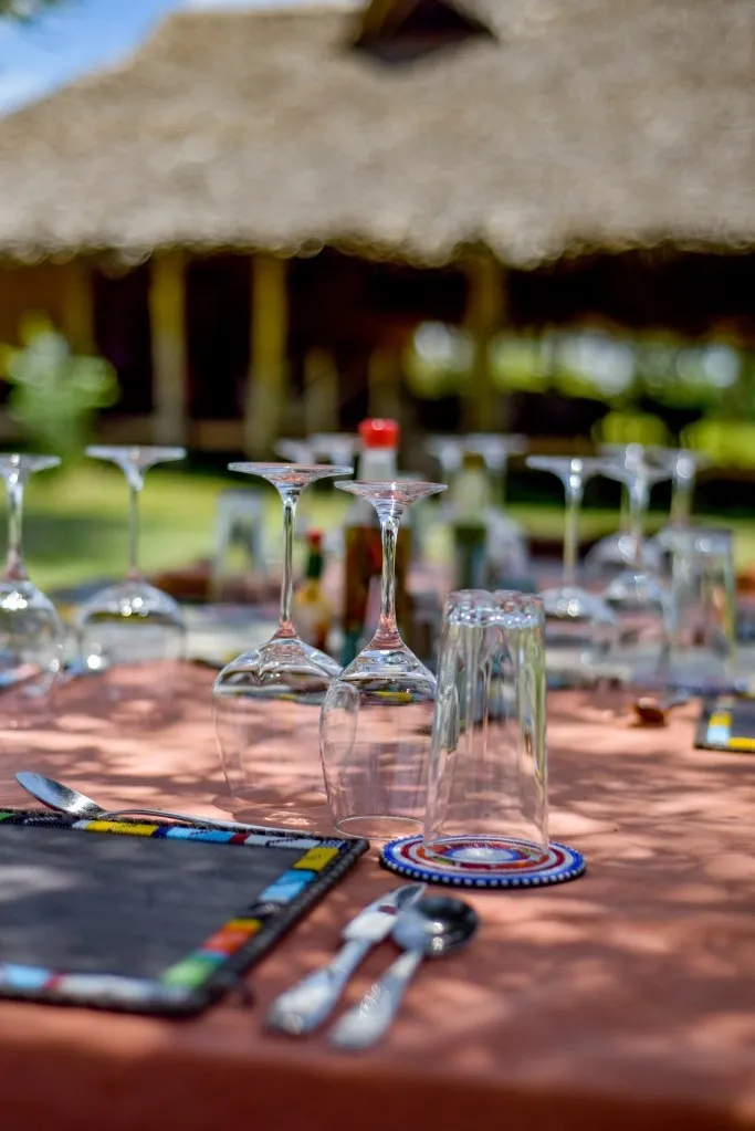 Dining table and glassware detail — Mara Siana Tented Camp