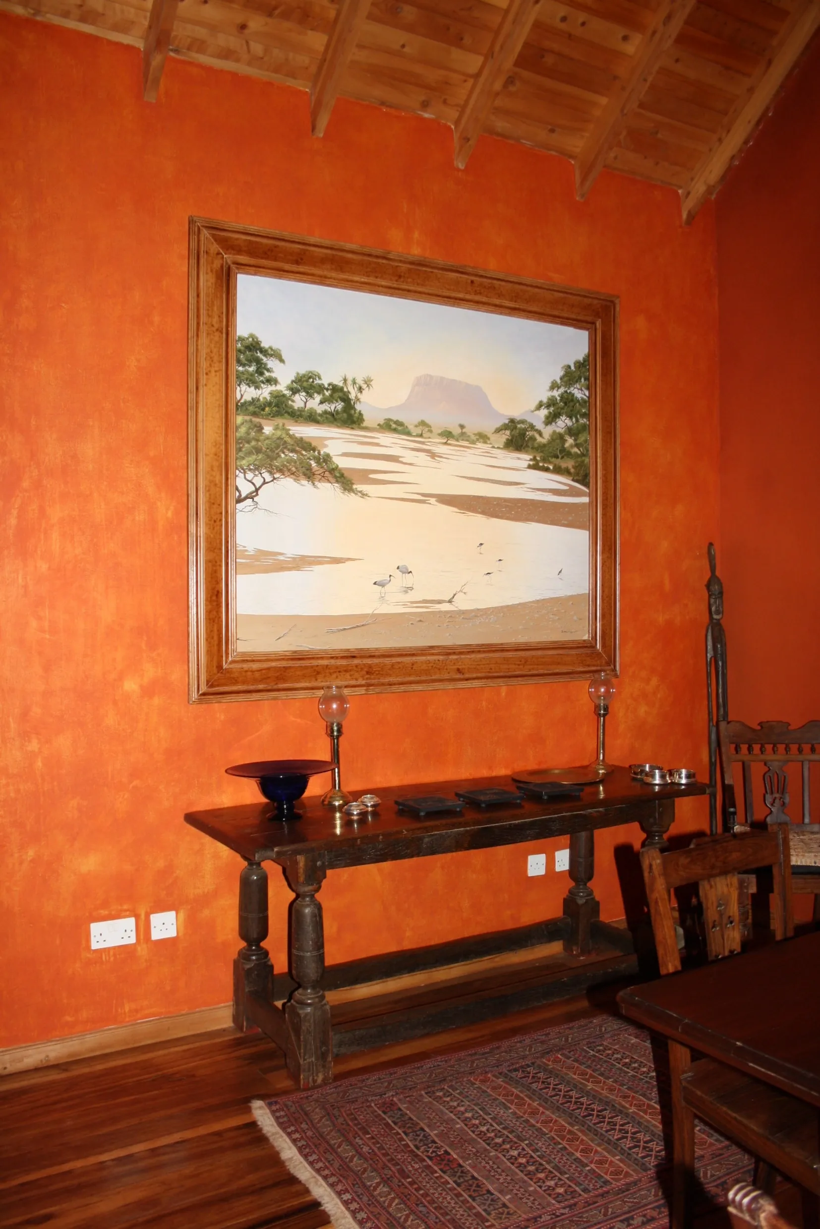 Entrance with artwork and furniture — Ngong